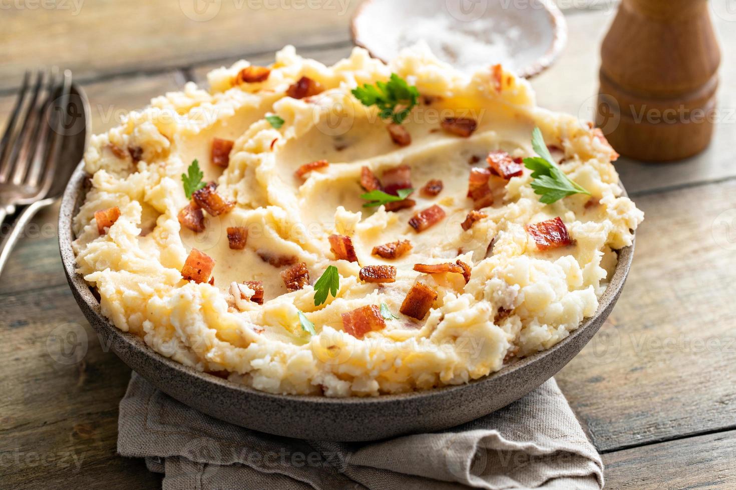 Bacon mashed potatoes with cheddar cheese and parsley photo