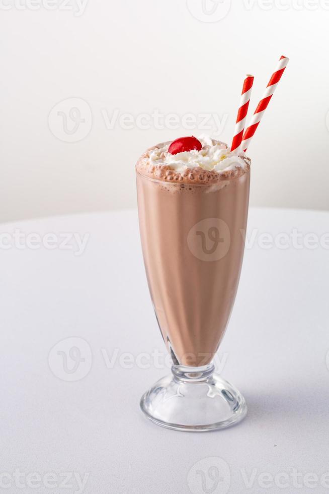 Chocolate milkshake with whipped cream photo