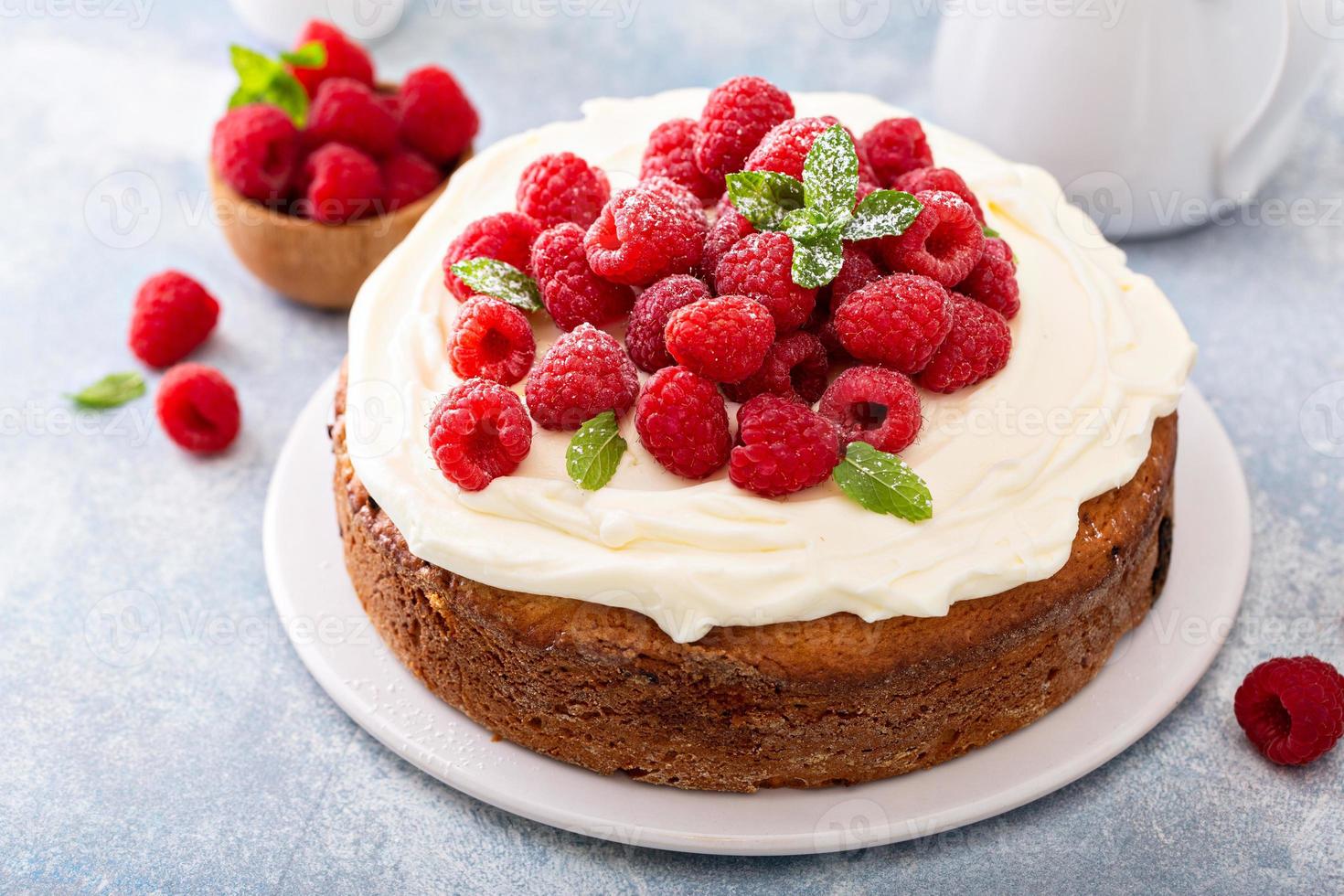 Simple summer cake with raspberries and frosting photo