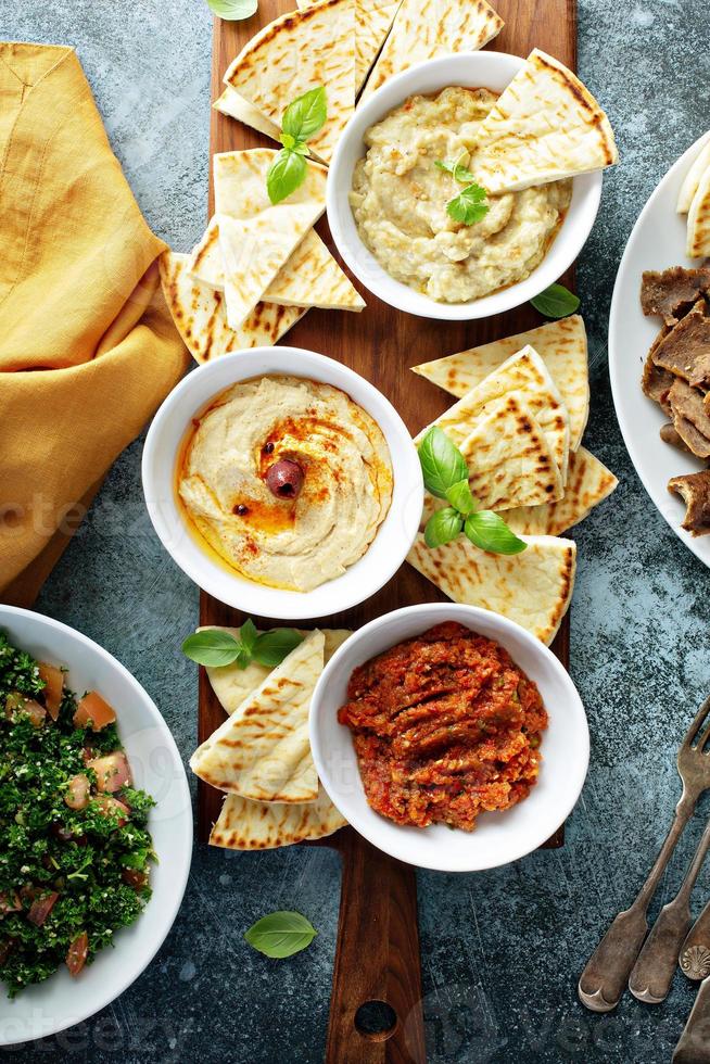 Mezze board with pita and dips photo