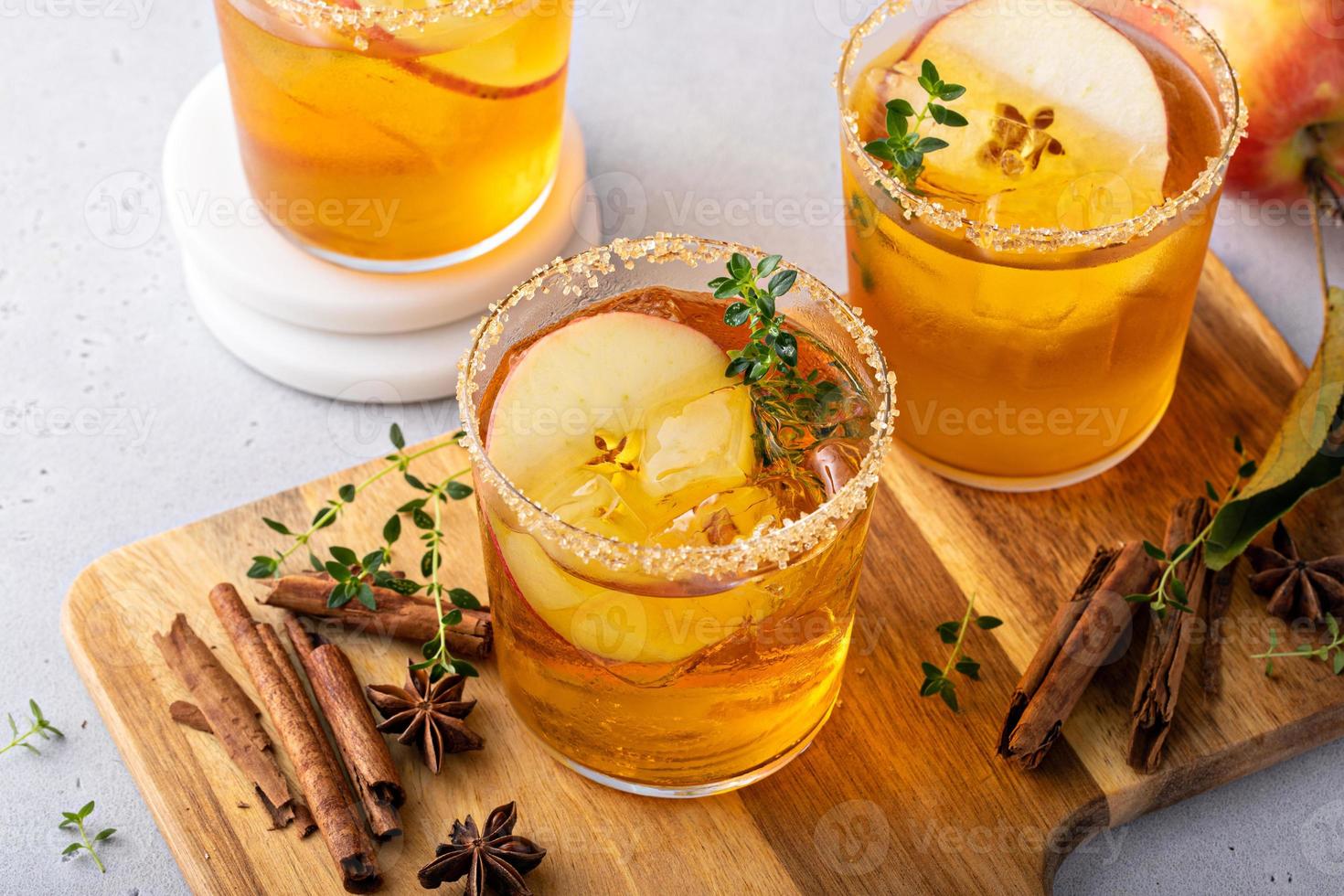 Hard apple cider cocktail with cinnamon and thyme, fall drink photo