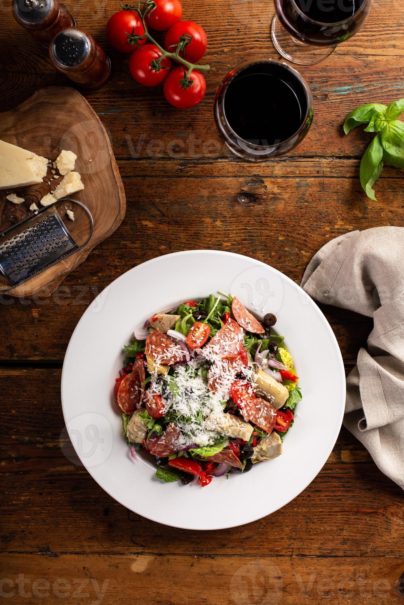 Italian antipasto salad with salami, artichoke hearts and olives
