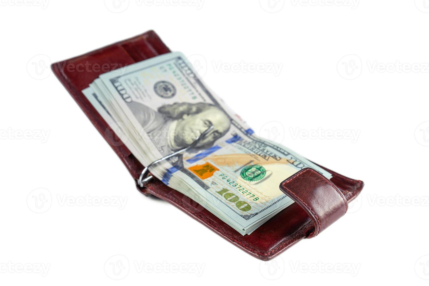 Pile of new design US dollar bills in brown wallet isolated on white background photo
