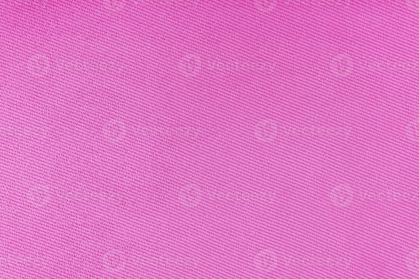 Texture of pink fabric diagonal weave pattern. Decorative textile background photo
