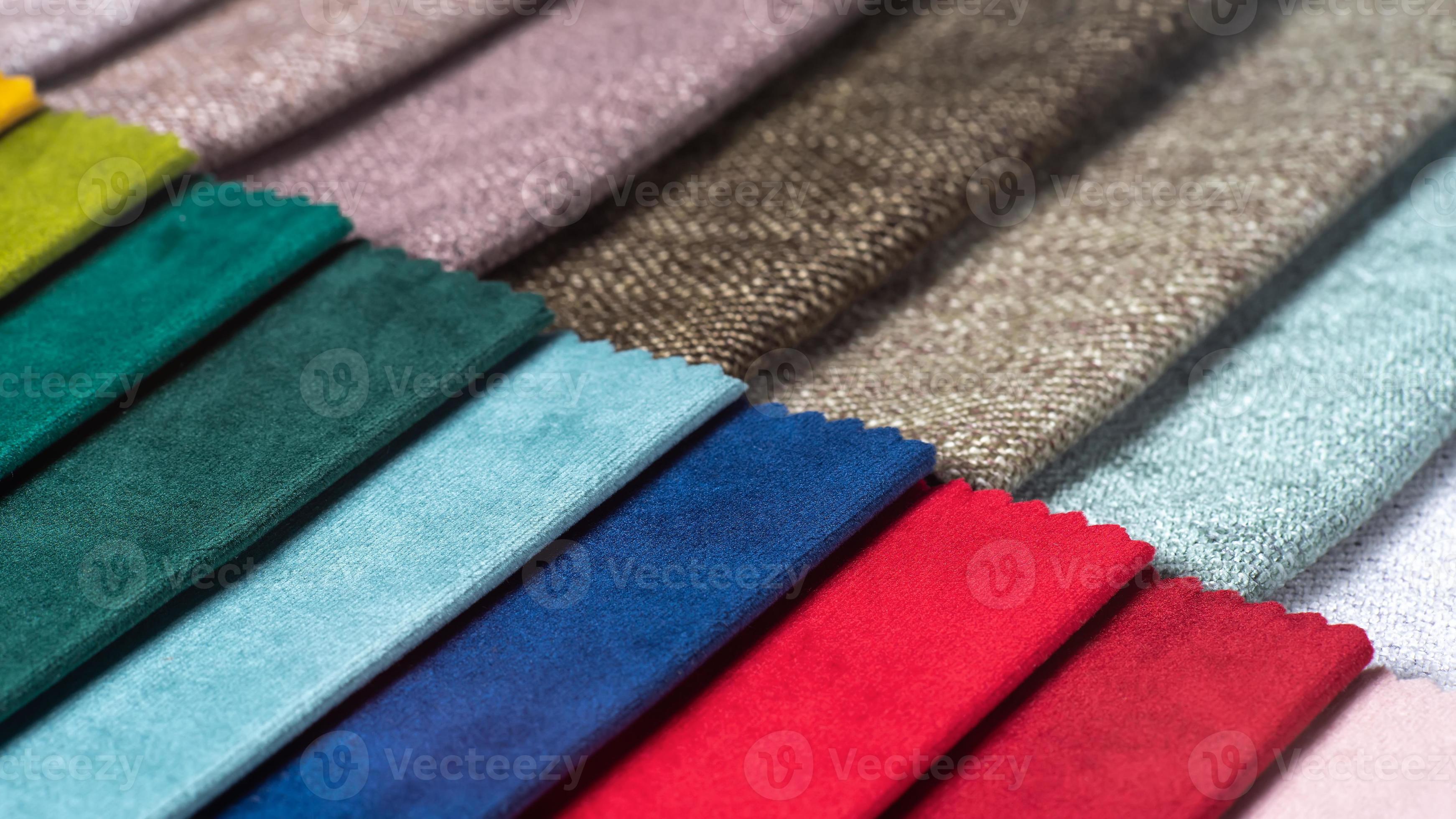 Multi colored set of upholstery fabric samples for selection, collection of textile swatches