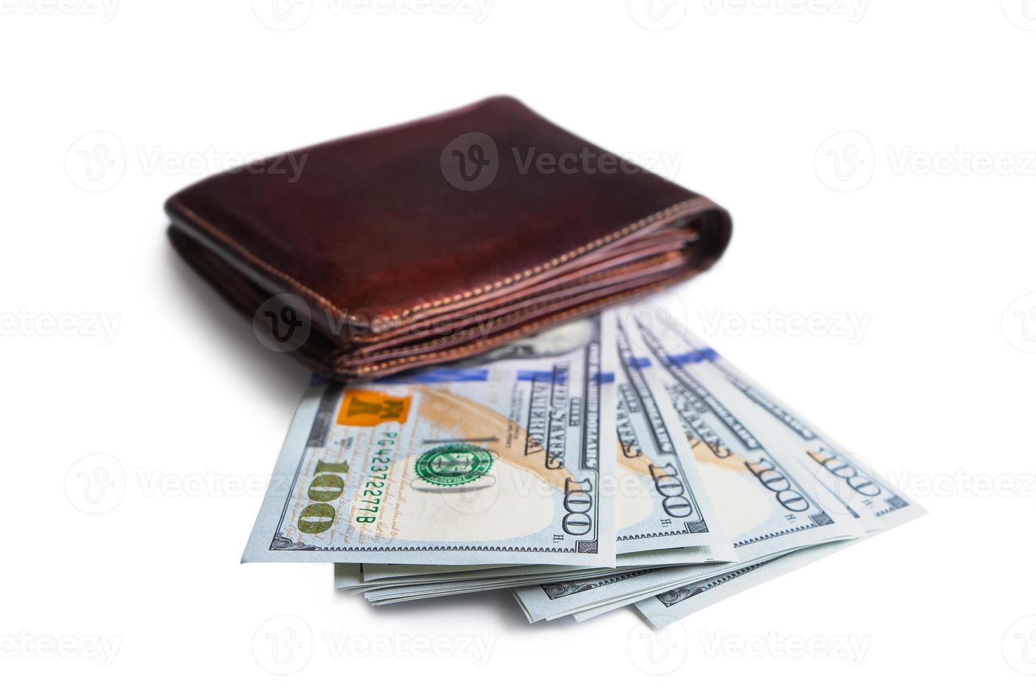 Pile of new design US dollar bills in brown wallet isolated on white background photo