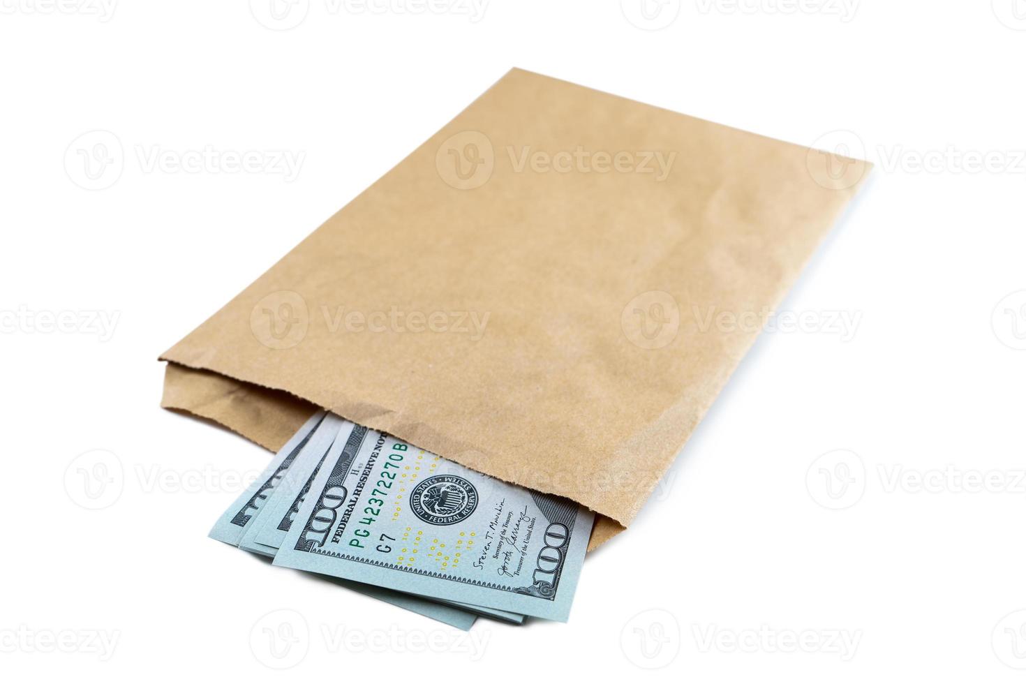 Pile of new design US dollar bills in brown envelope isolated on white background photo