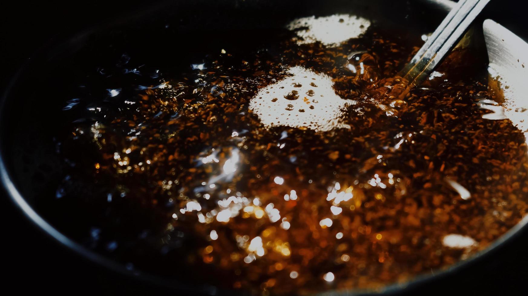 Closeup Of Boiling Tea In A Pot Under Sunlight in Karachi Pakistan 2022 photo