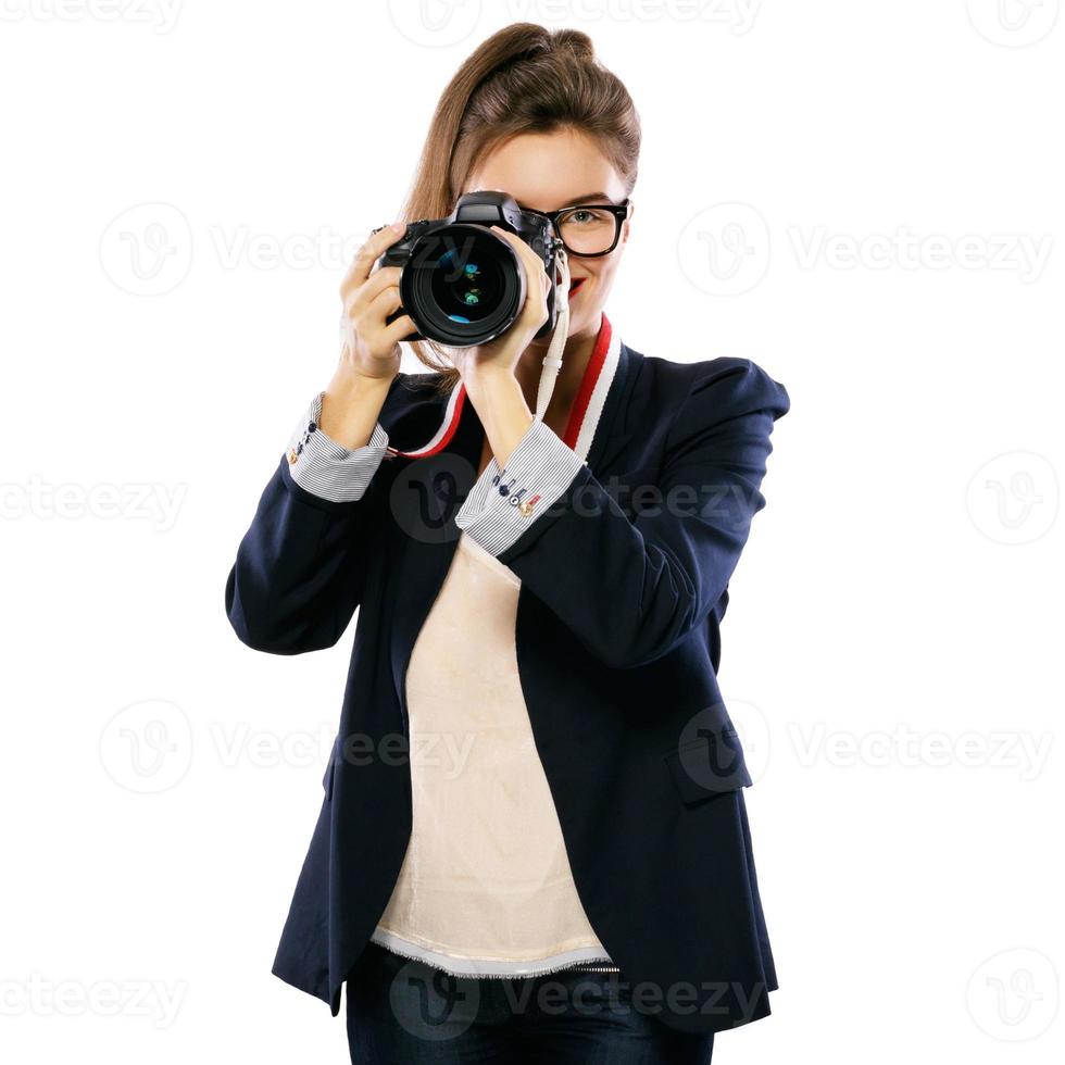 Woman photographer with a DSLR camera on white background photo