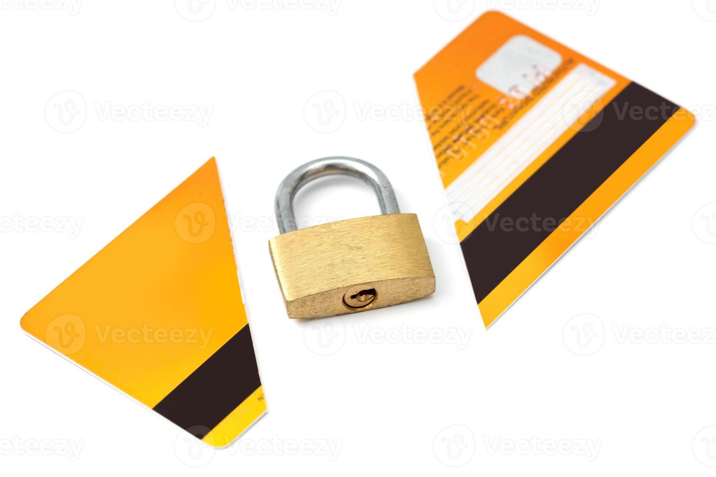 Padlock and broken credit card on white background photo