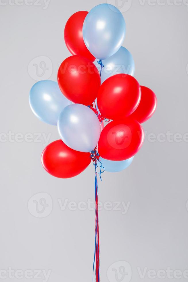 BIg amount of colorful balloons isolated on gray background photo