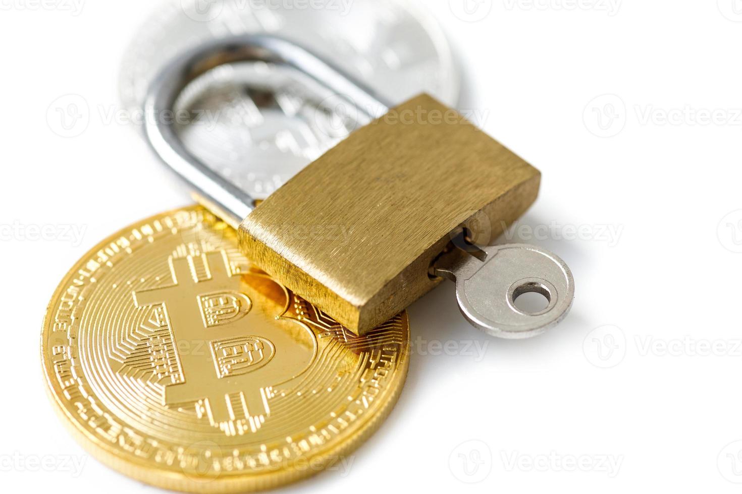 Bitcoin coins and padlock on white background photo