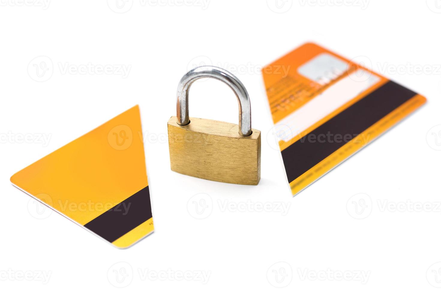 Padlock and broken credit card on white background photo