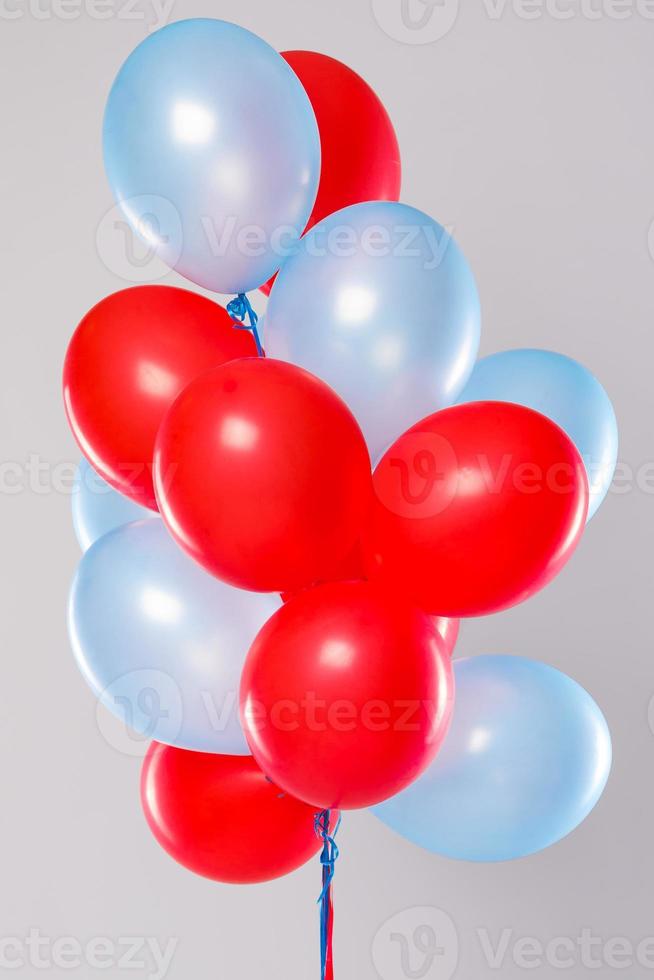 BIg amount of colorful balloons isolated on gray background photo