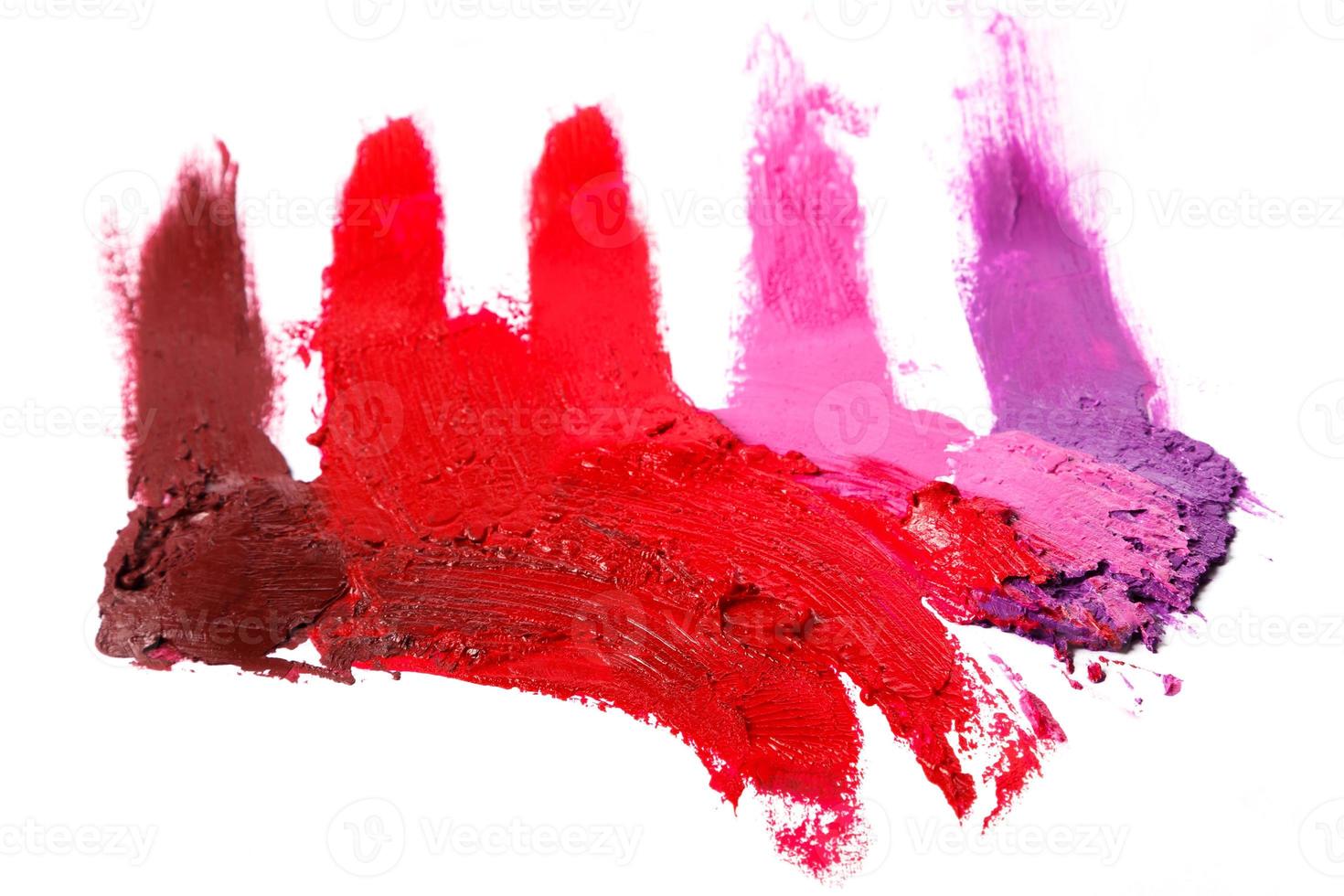 Different multi colored samples of a smudged lipstick photo