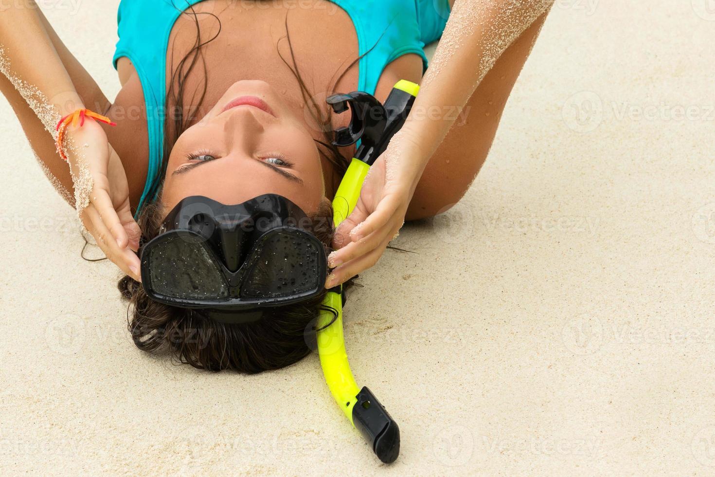 Woman in the sea during snorkeling in blue water photo