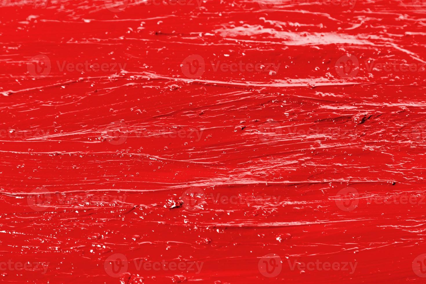 fondo de una textura de lápiz labial rojo manchado foto