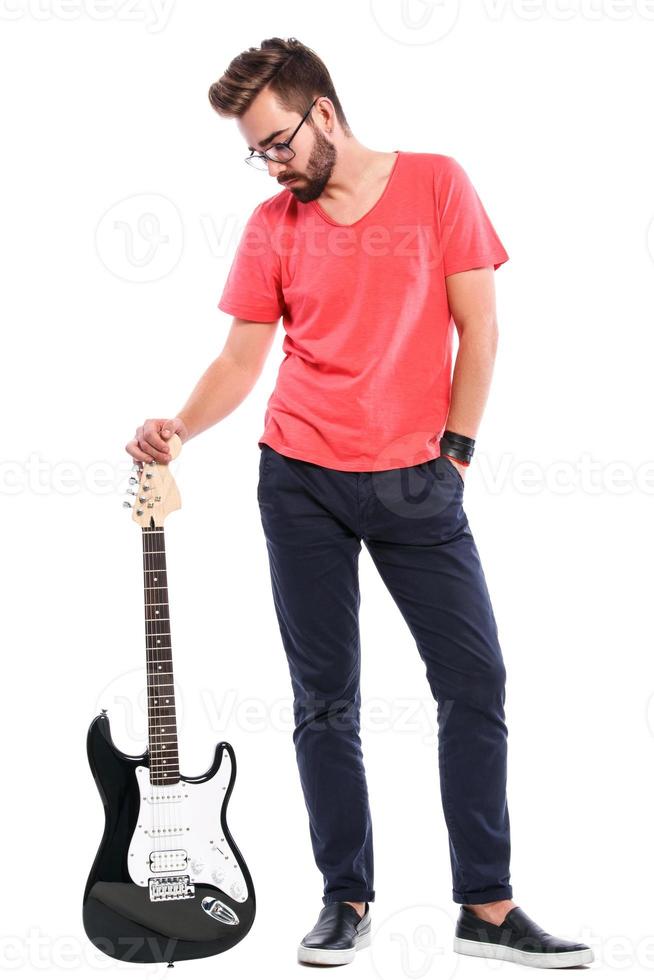 Guy with a guitar on white background photo