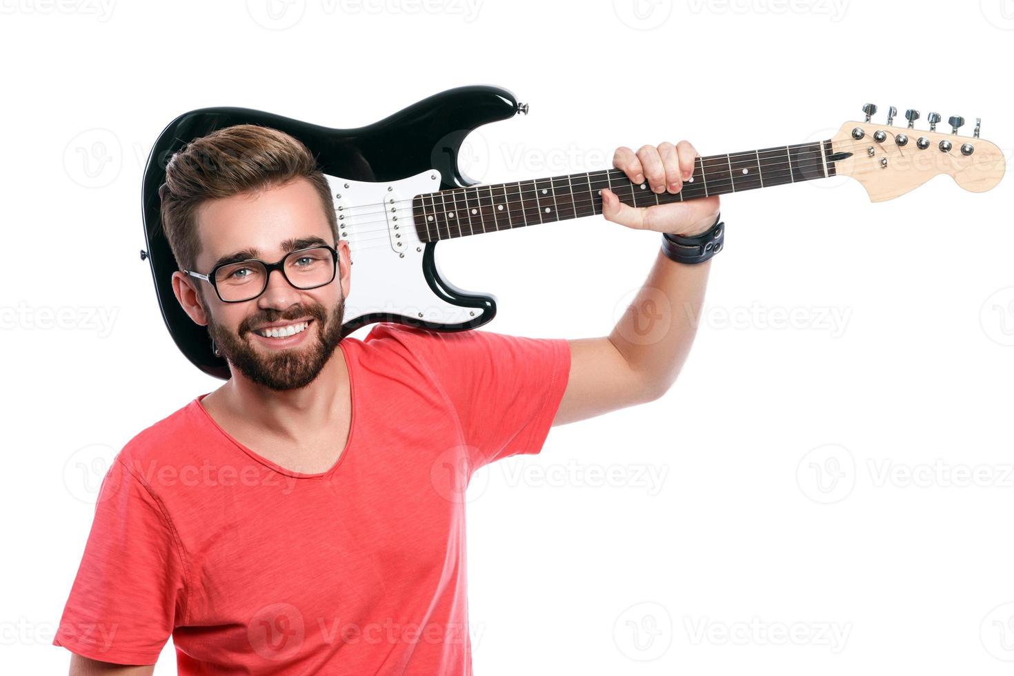 Guy with a guitar on white background photo