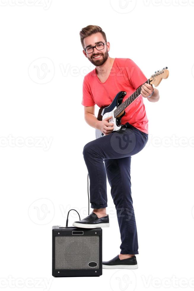 Guy with a guitar on white background photo