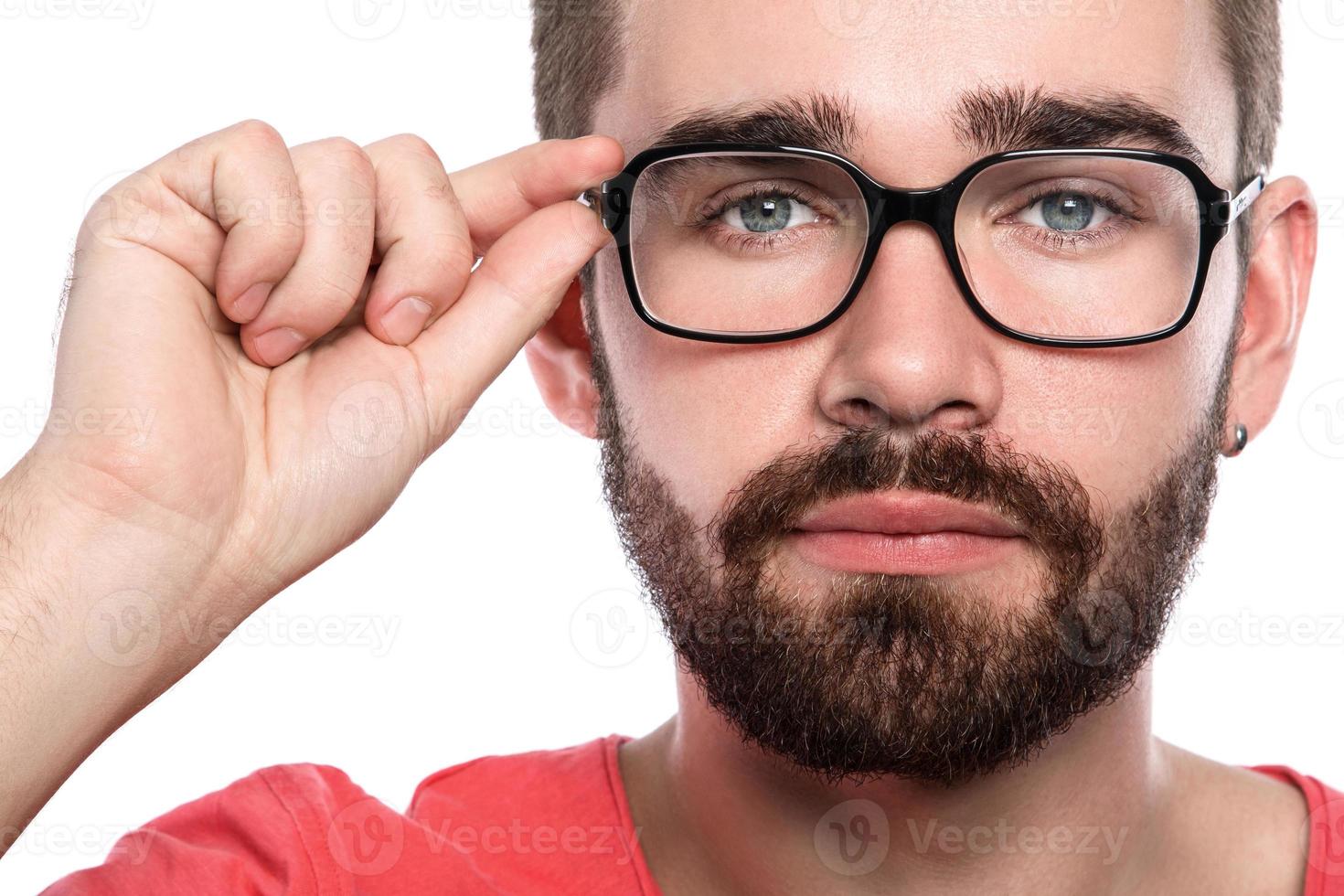 Handsome bearded man in eyeglasses on white background photo