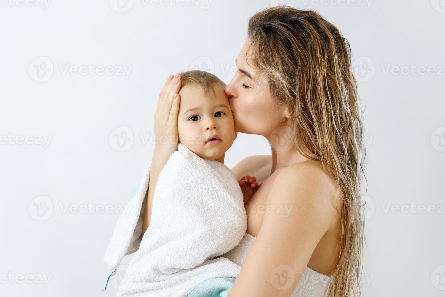Young and happy mother and her cute little baby after bathing 16233766