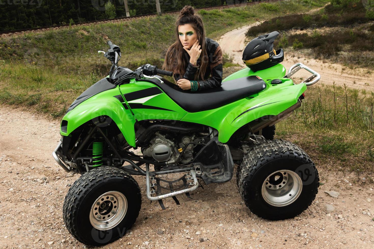 Stylish and beautiful woman and the ATV photo