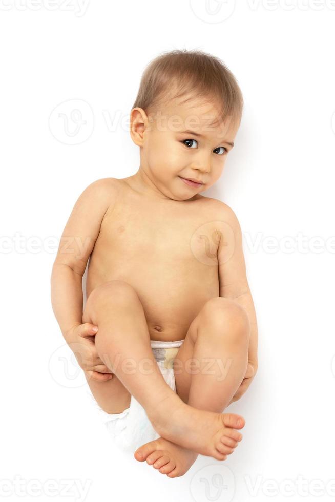 Cute little baby in diaper on white background photo