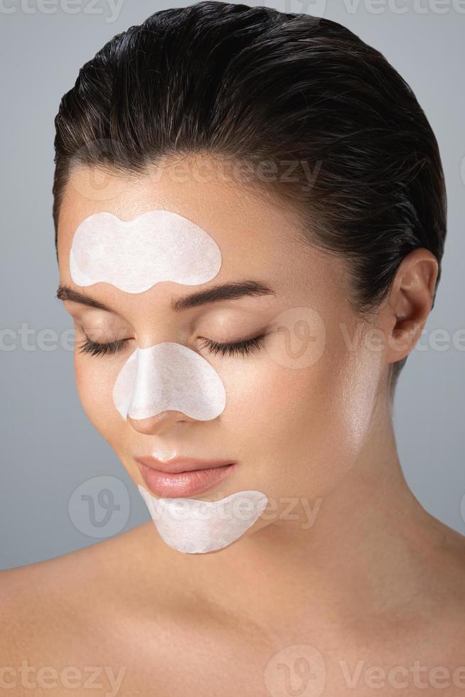 Beautiful woman with a cleansing pore strips on her face 16234062 Stock