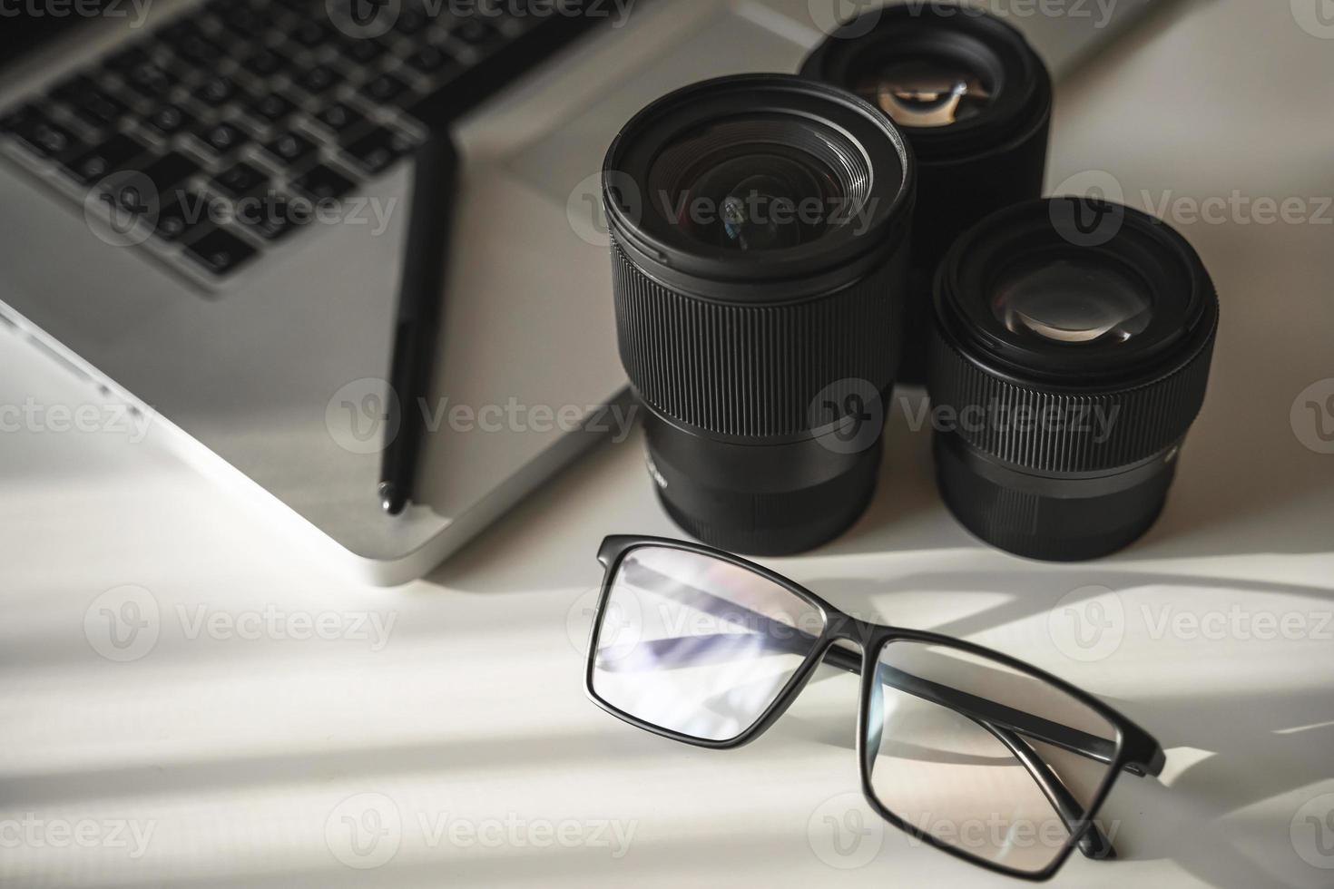 Photographer's workplace with a different prime lenses photo