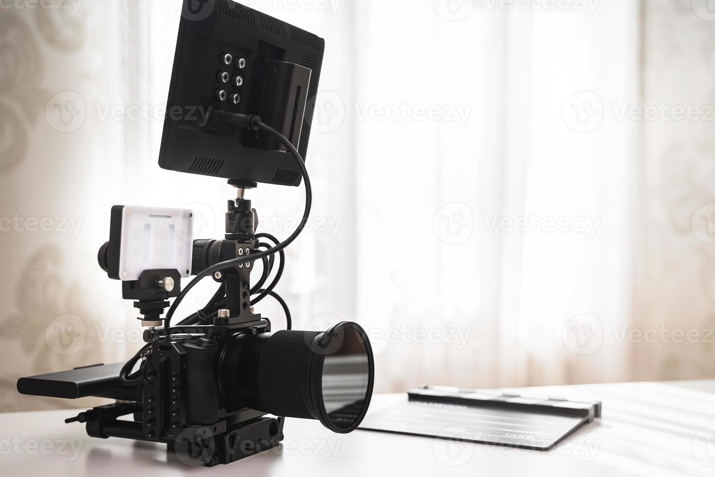 Modern mirrorless camera rig and clapperboard photo