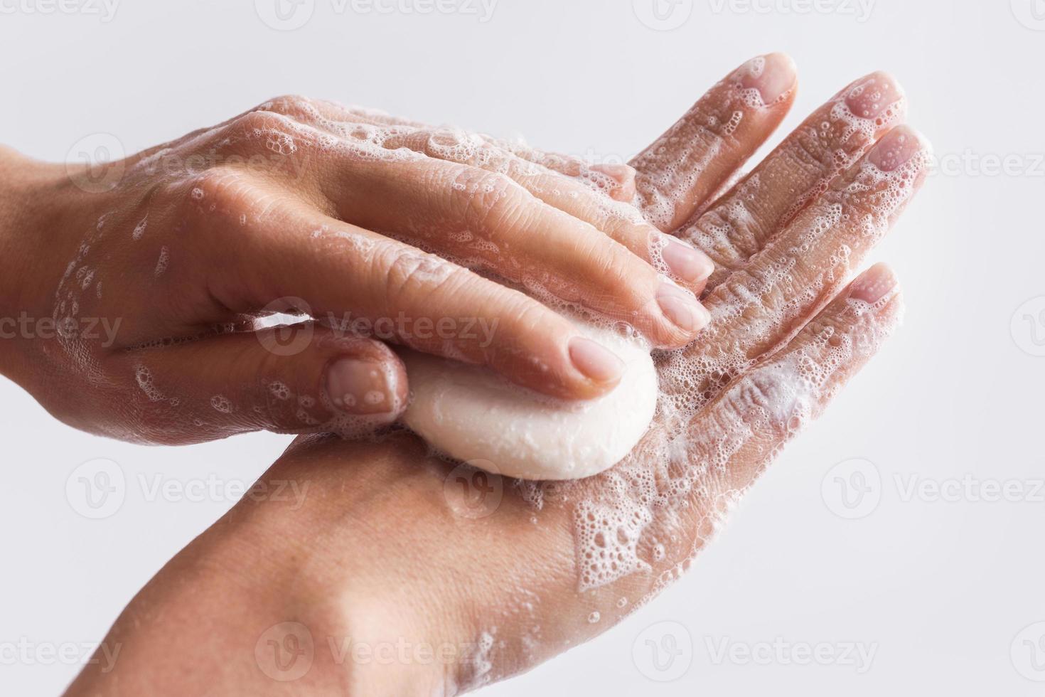 Close-up of female hands with a soap photo