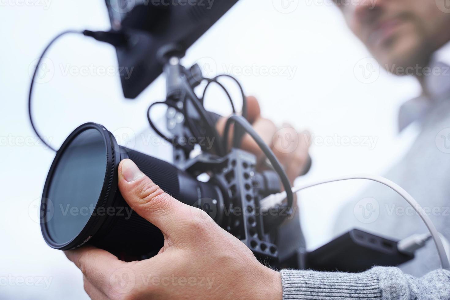 Videographer with a modern mirrorless camera rig photo