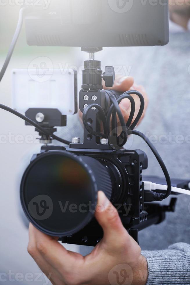 Videographer with a modern mirrorless camera rig photo