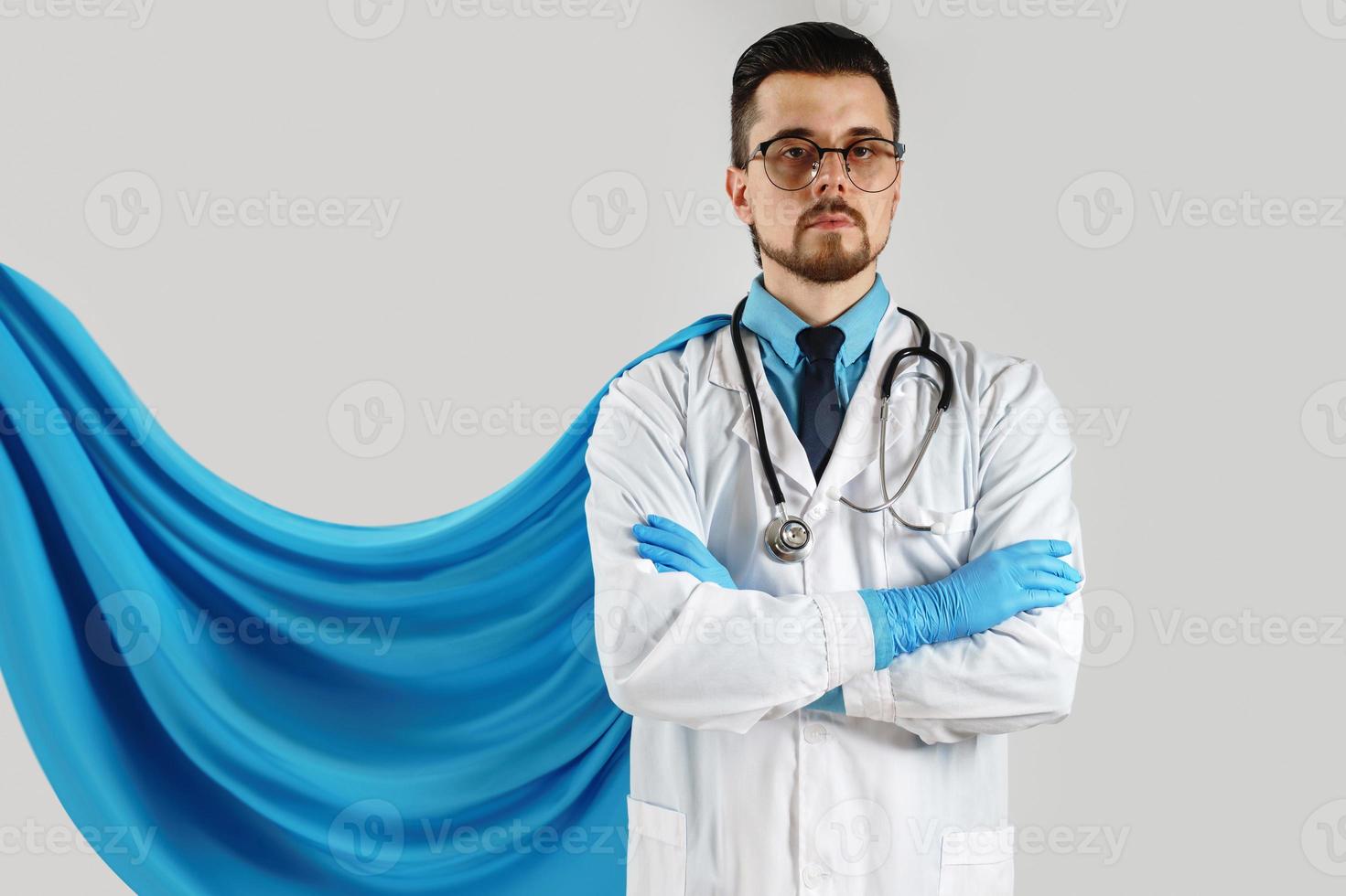 Brave man superhero doctor with blue cape photo