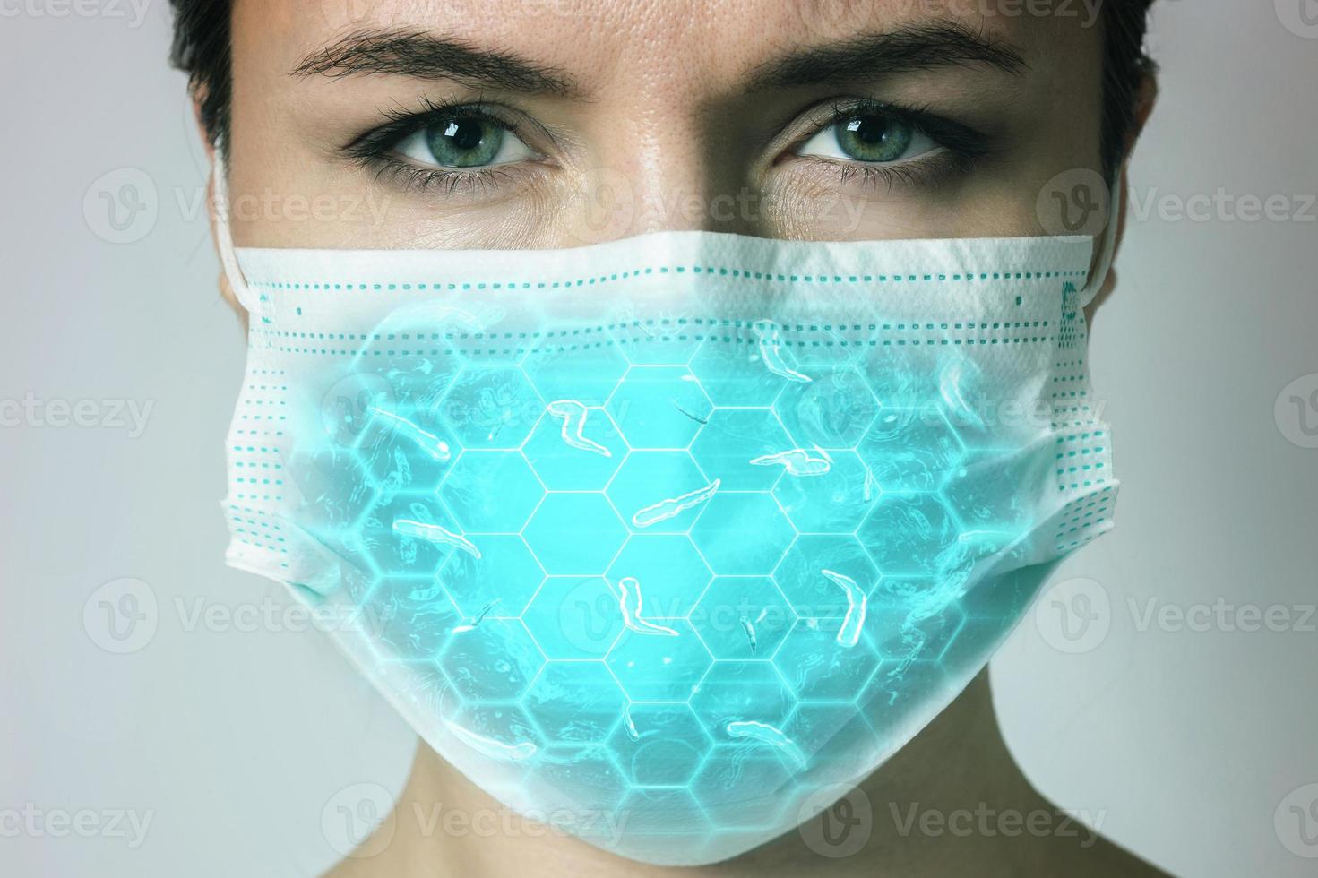 Young woman is wearing a face mask for protection against virus photo