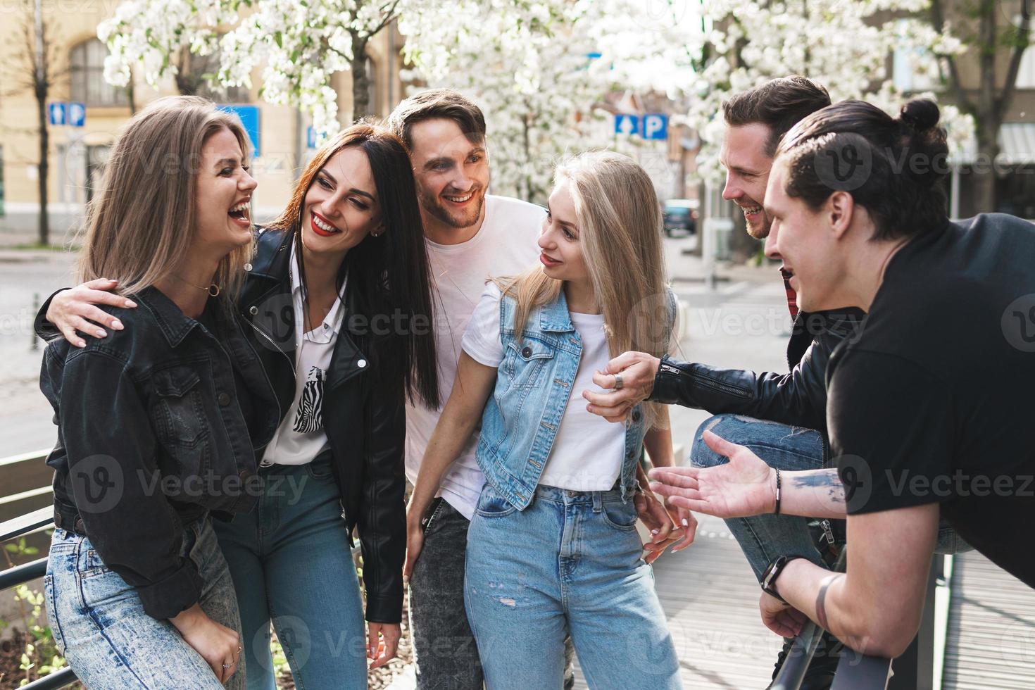 Group of best friends are having fun on a street photo