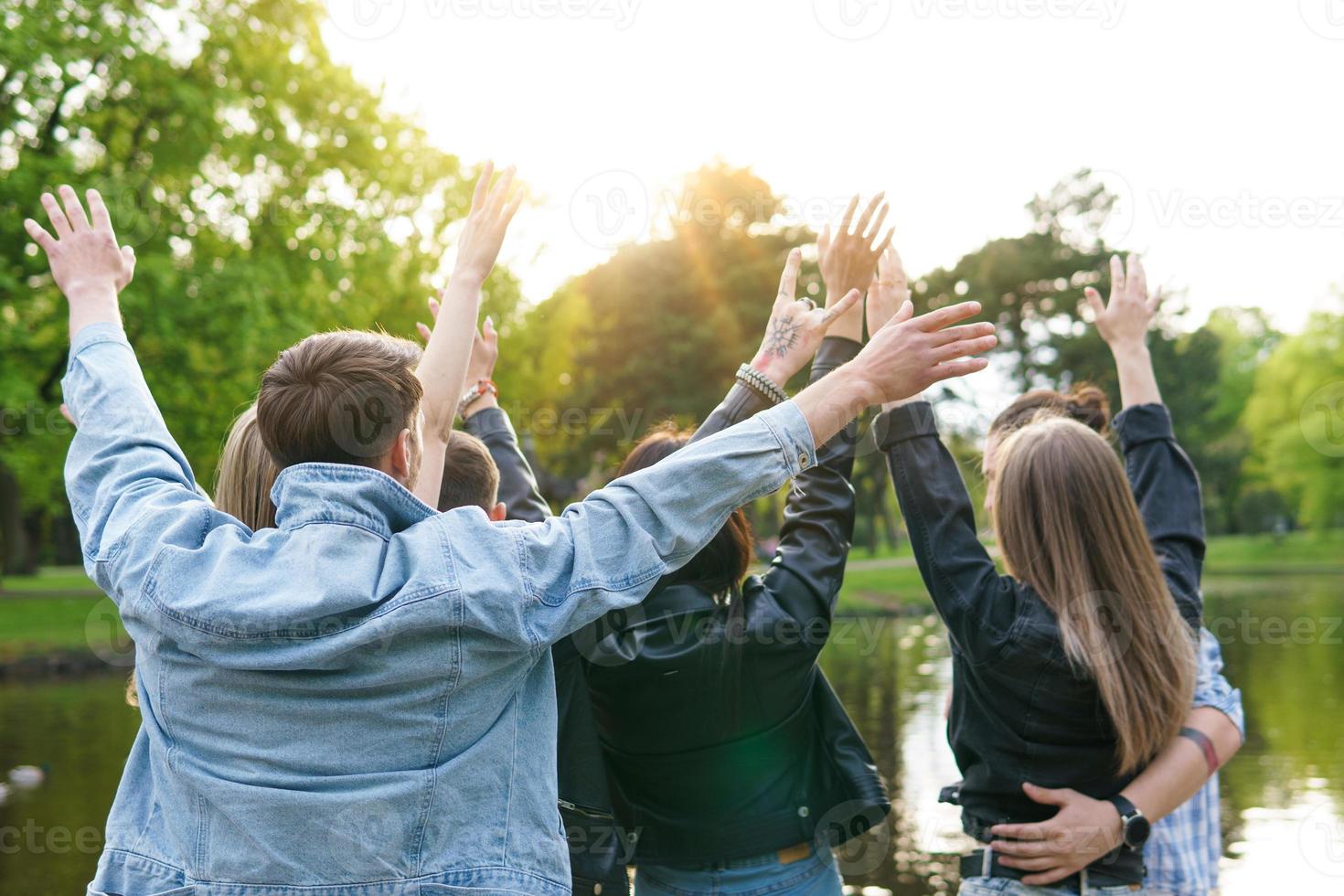 Group of young and happy friends enjoying freedom photo