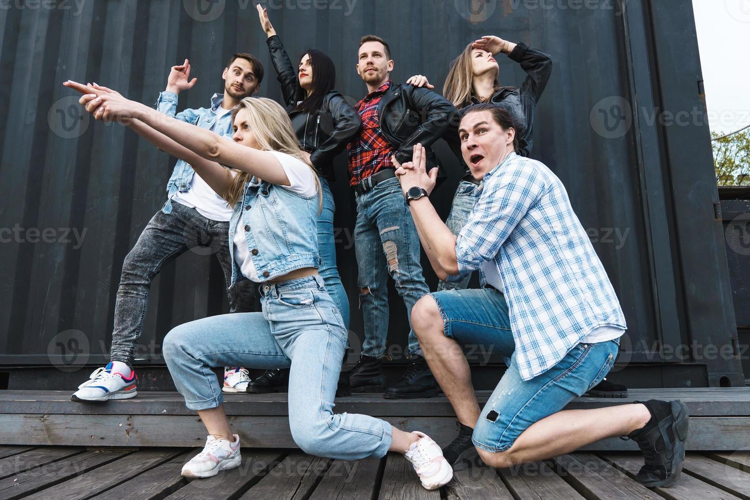 Group of young and stylish people in posing as funny superheroes photo