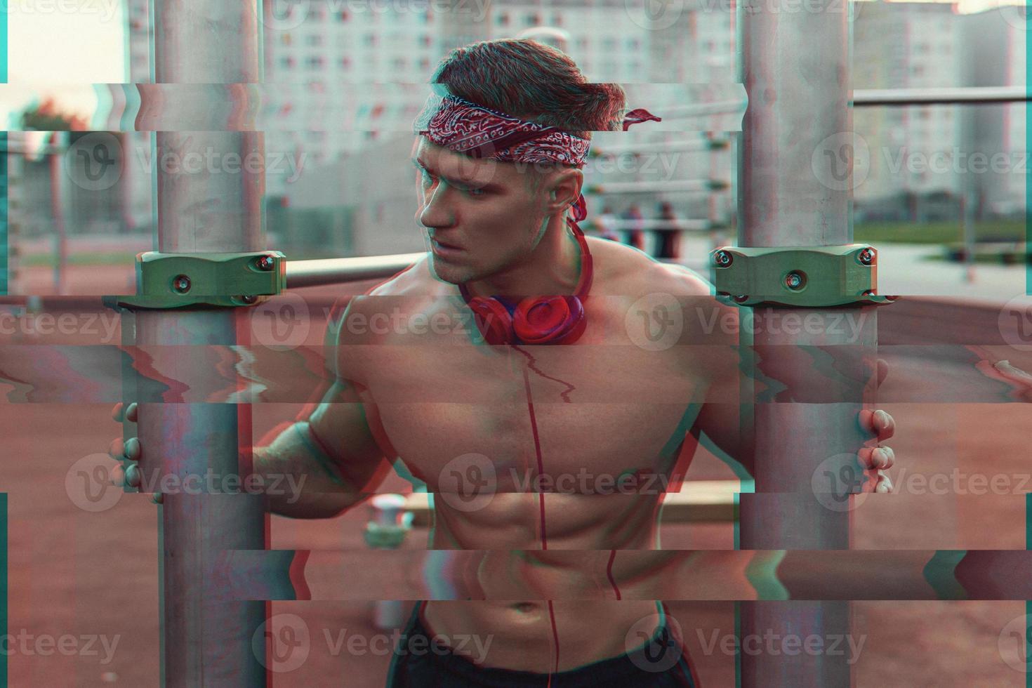 Muscular man on the street with a noisy VHS glitch effect photo