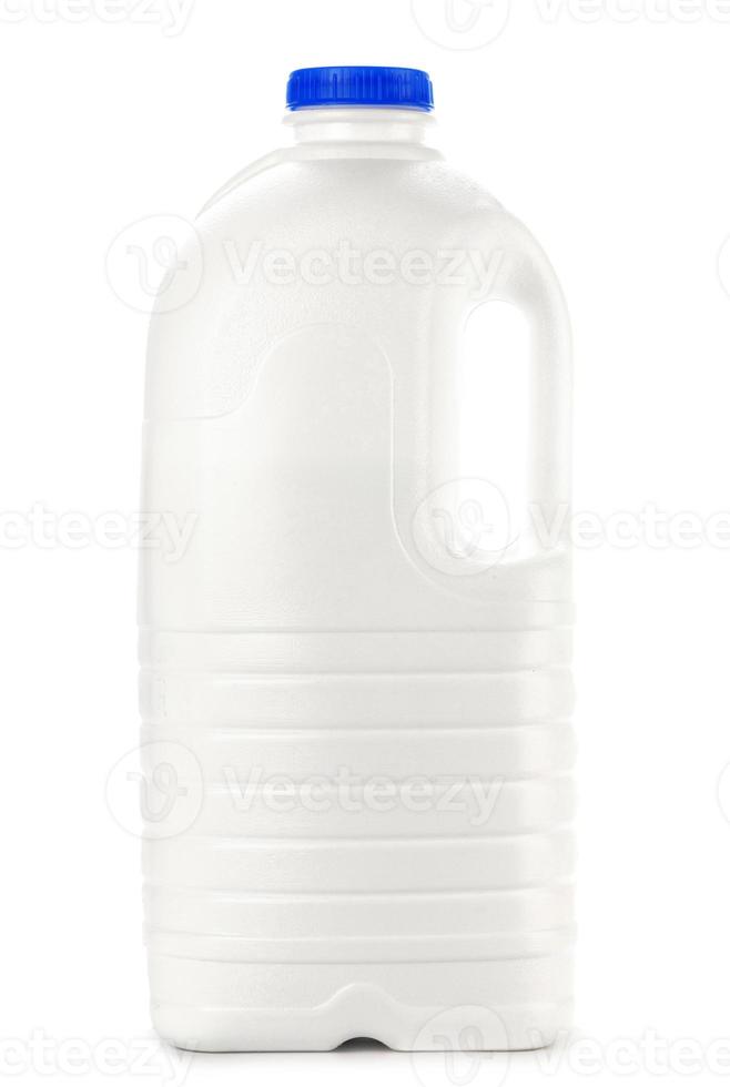 Big plastic bottle of milk on white photo