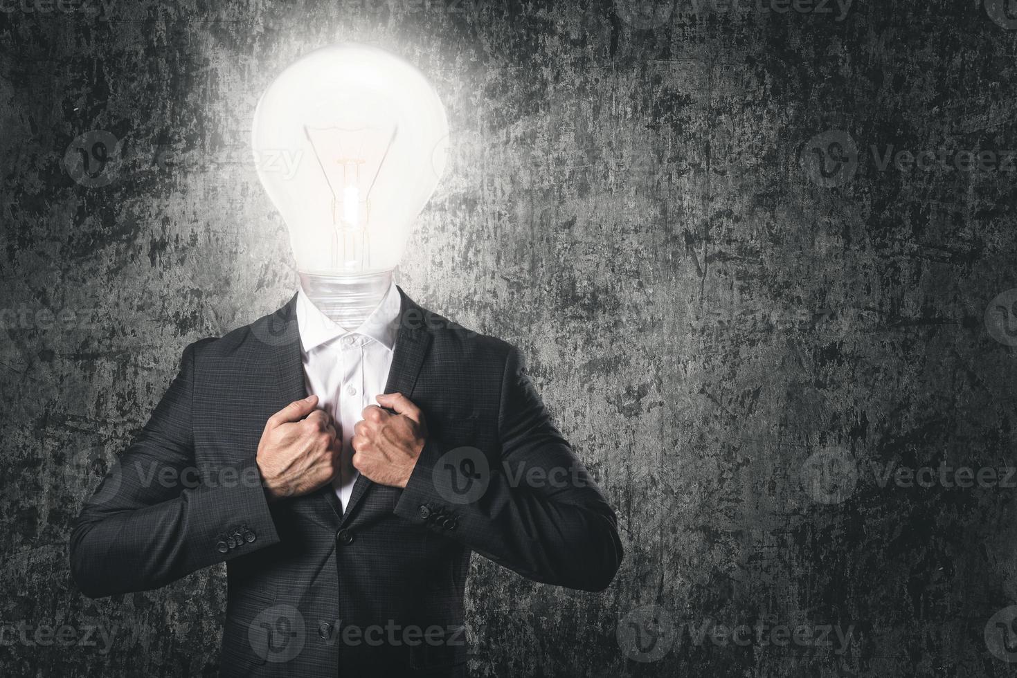 Got an idea Businessman with light bulb instead head. photo