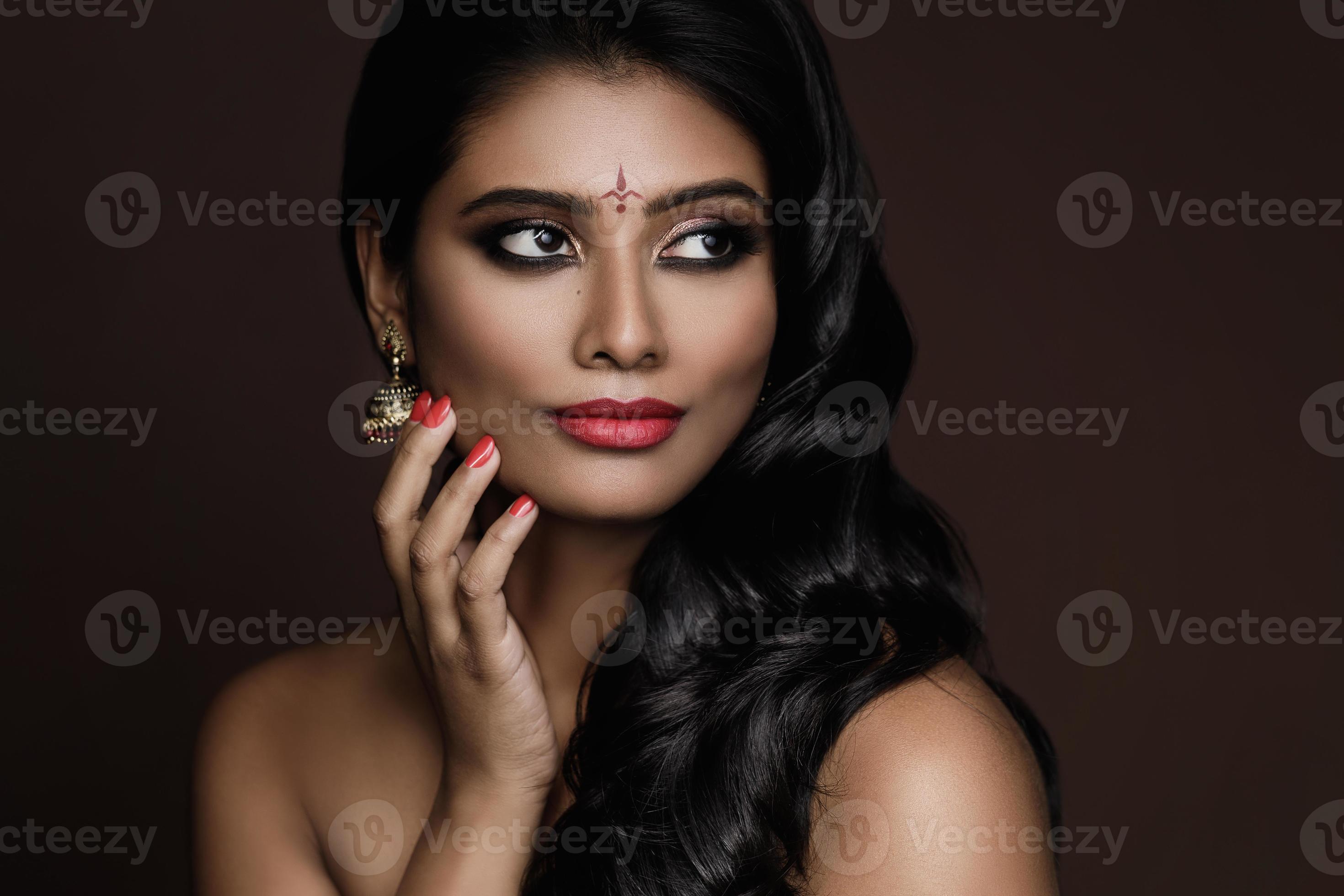 Portrait of Indian woman with beautiful makeup and hairstyle on brown background 16235648 Stock Photo at Vecteezy Portrait of Indian woman with beautiful makeup and hairstyle on brown background 16235648 Stock Photo at Vecteezy