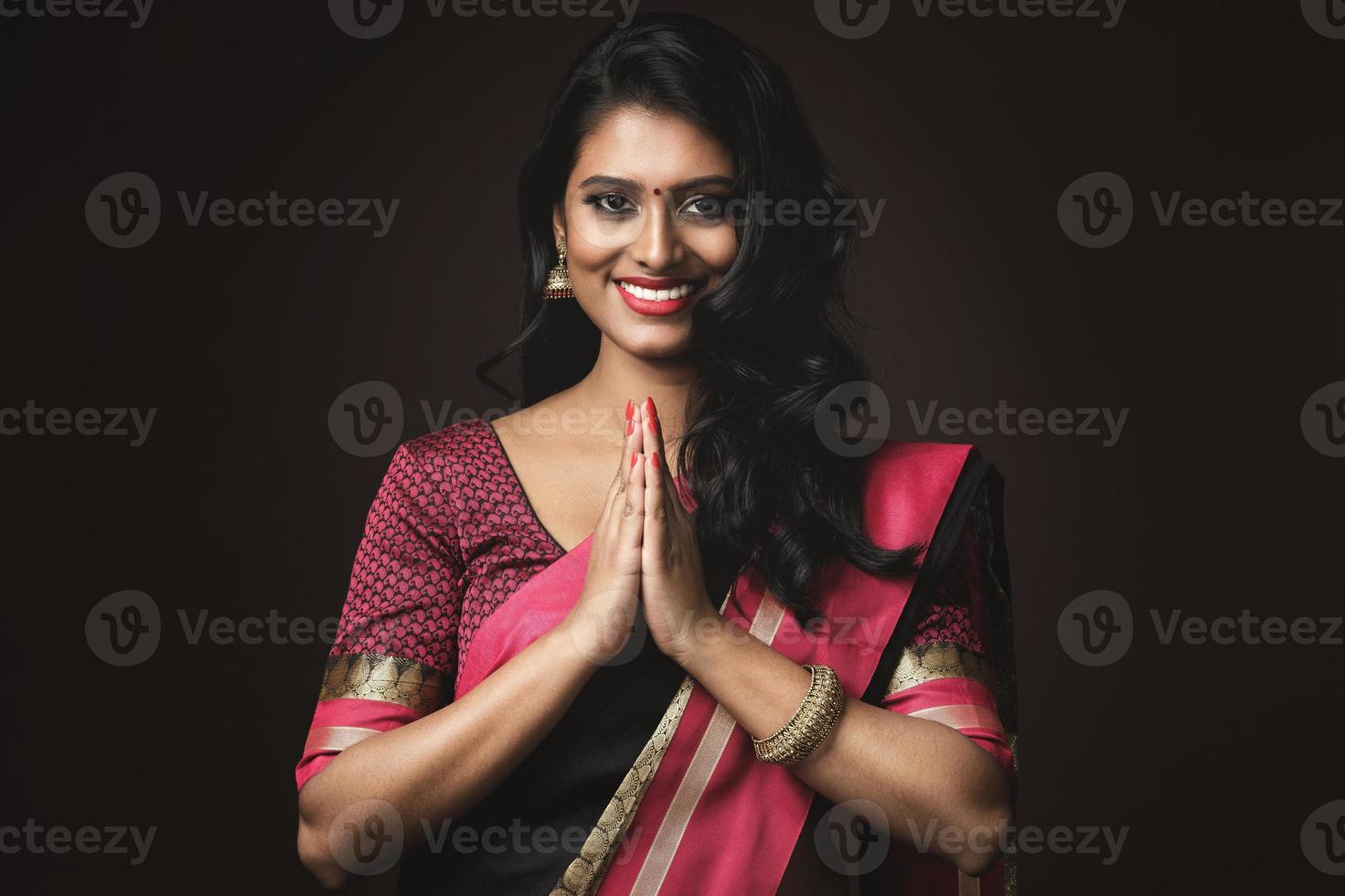 Beautiful Indian woman wearing traditional sari dress photo