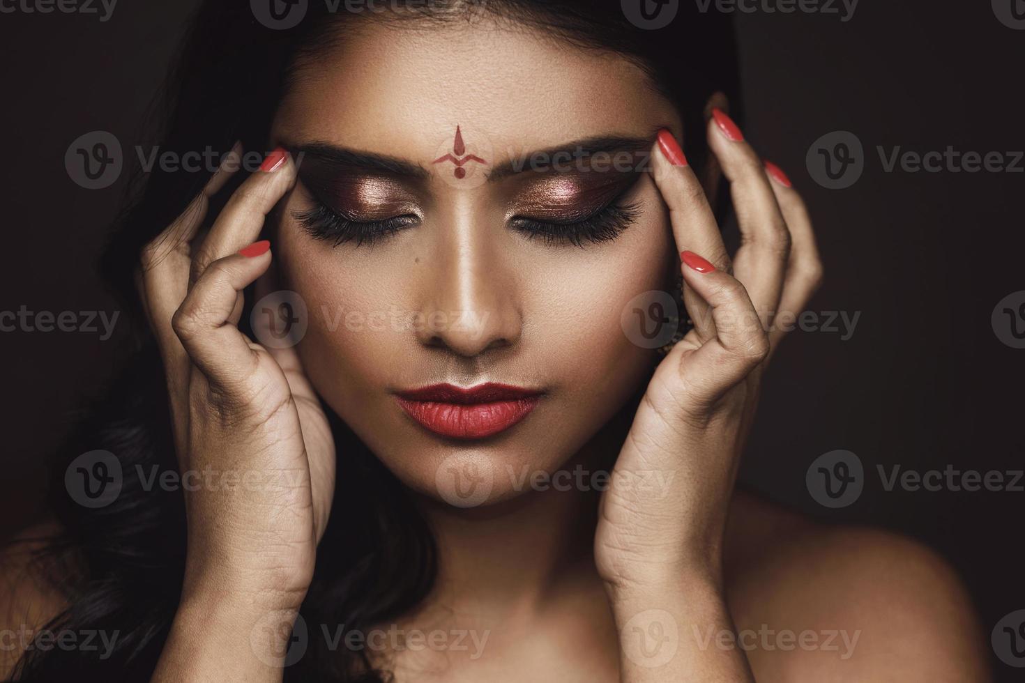 Portrait of Indian woman with beautiful makeup and hairstyle photo