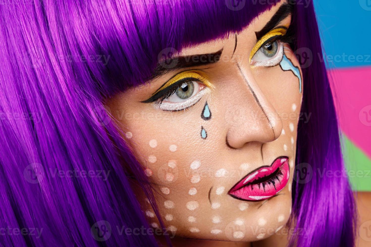 Model in creative image with pop art makeup photo