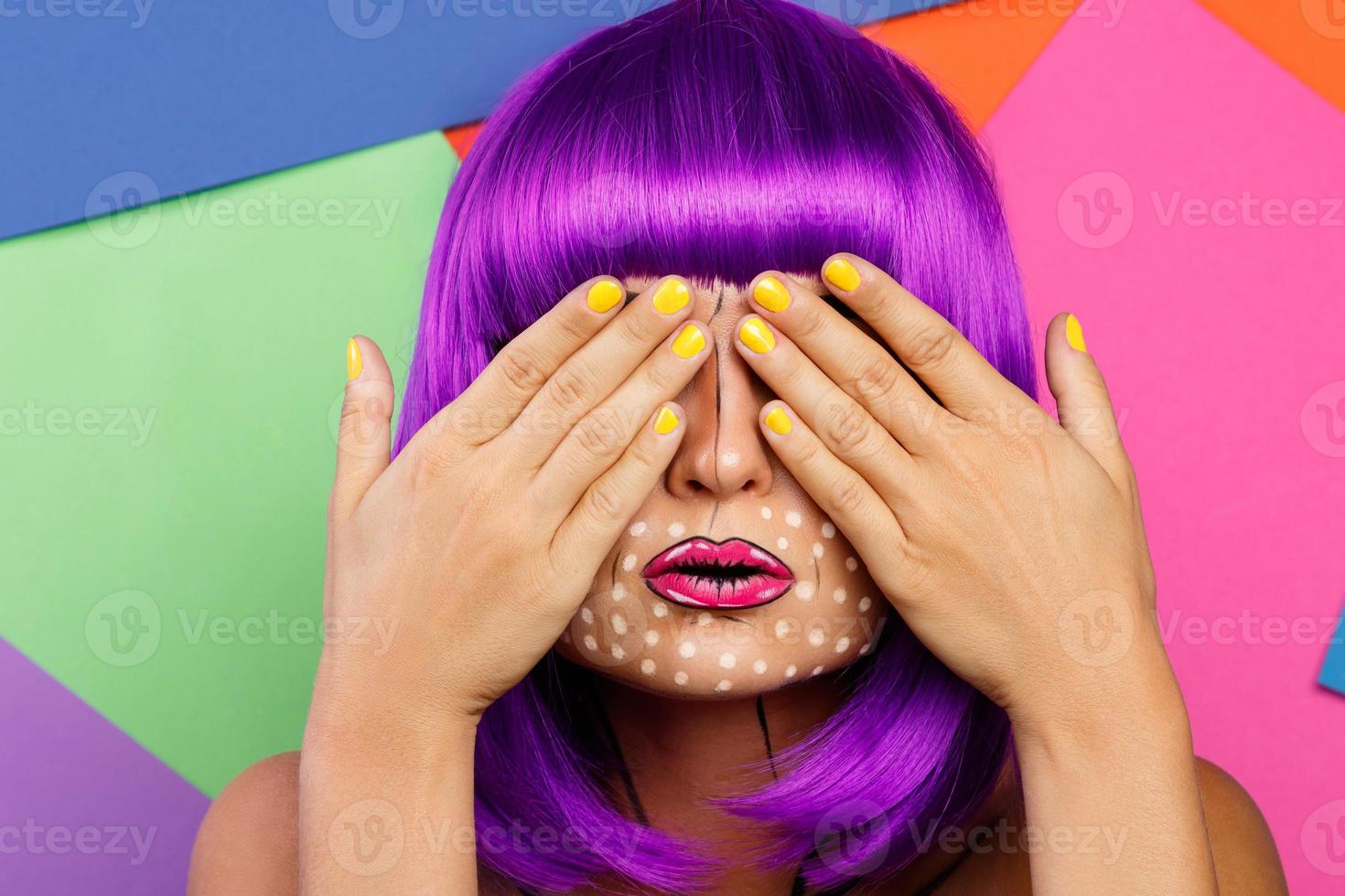 Model in creative image with pop art makeup photo