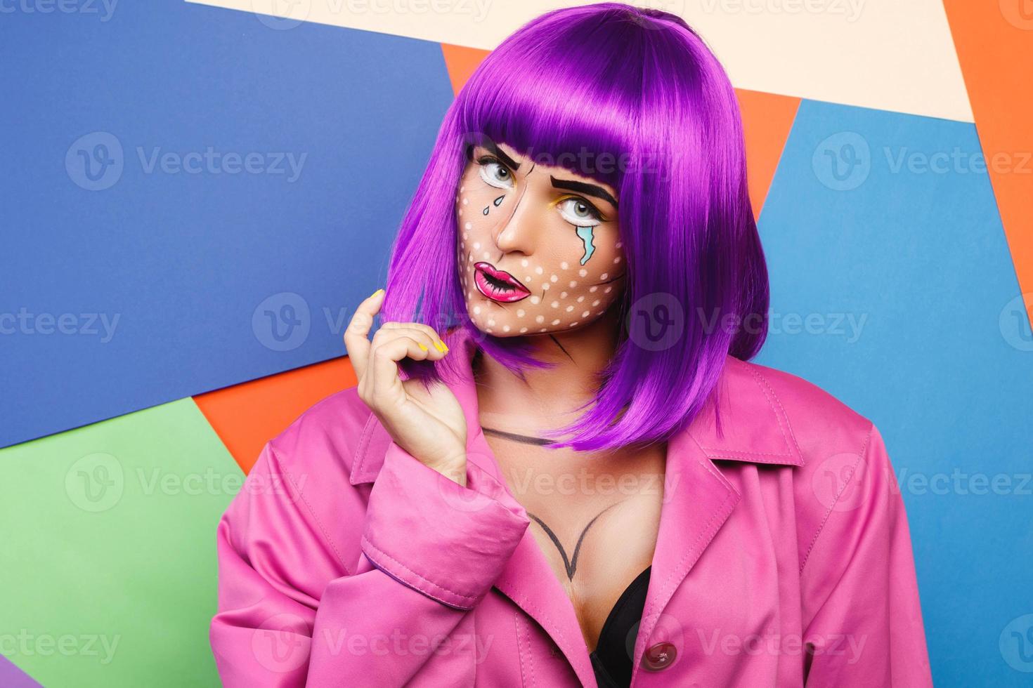 Model in creative image with pop art makeup photo