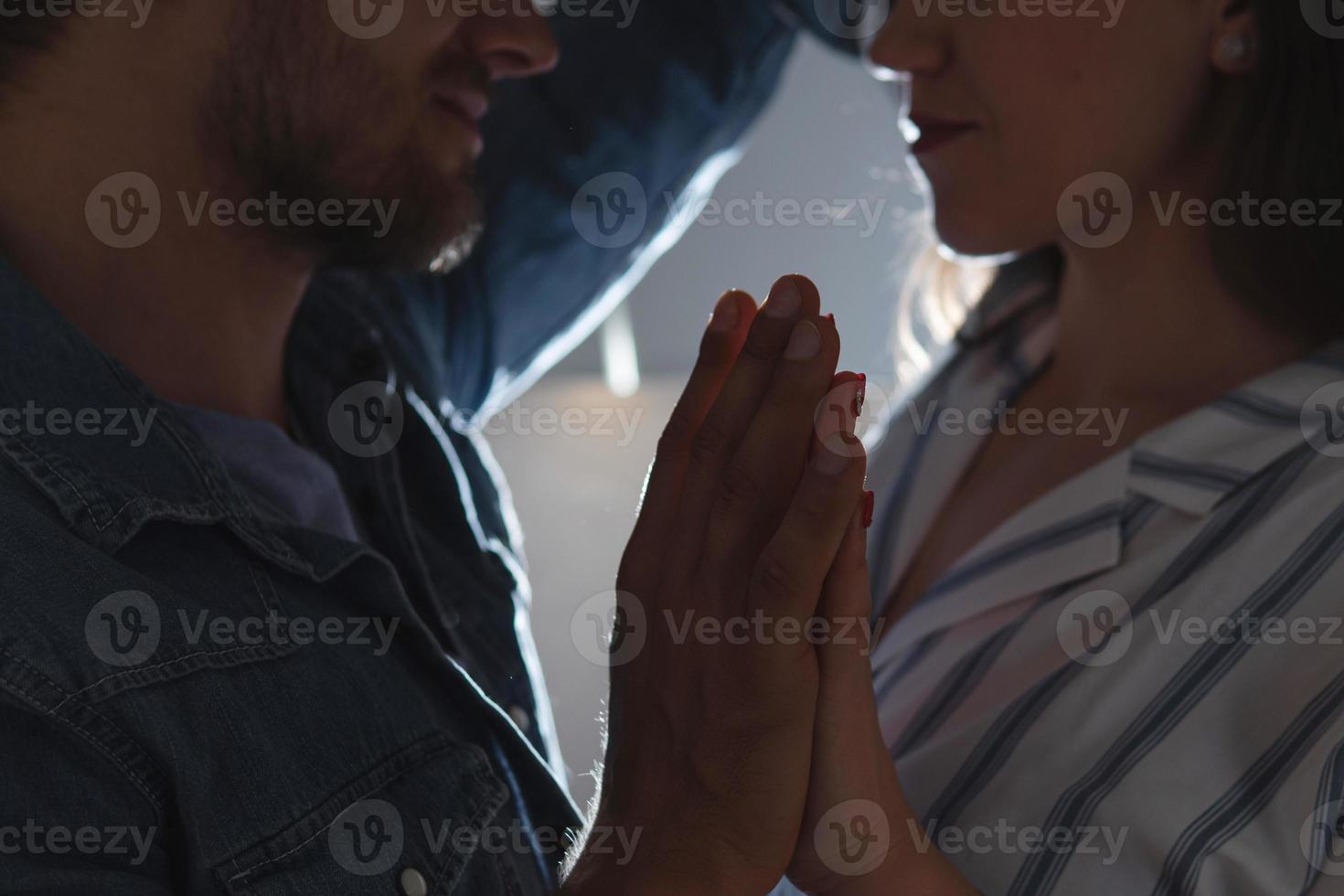 Portrait of young loving couple at kitchen photo