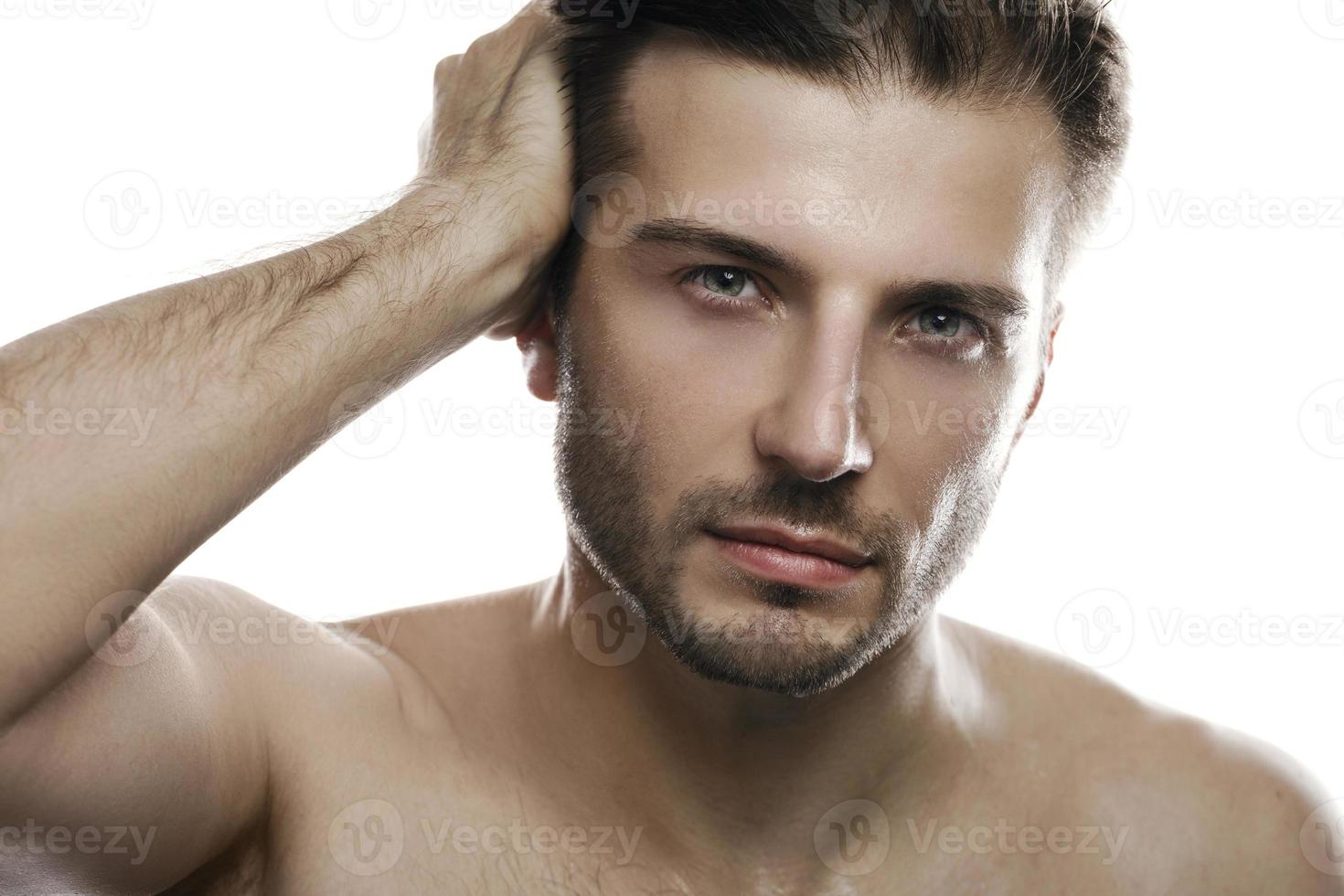 Young and handsome man on white background photo